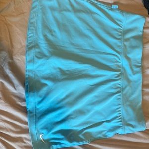 Blue athletic Nike skirt with built in shorts